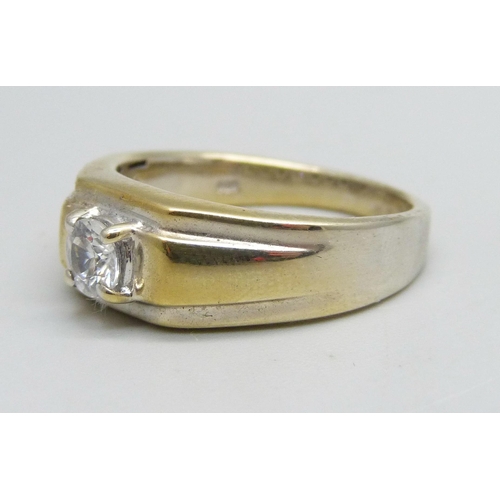 1125 - A silver gilt ring set with a white stone, U