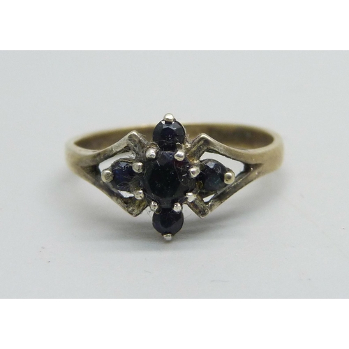 1126 - A silver gilt ring set with five sapphires, O/P