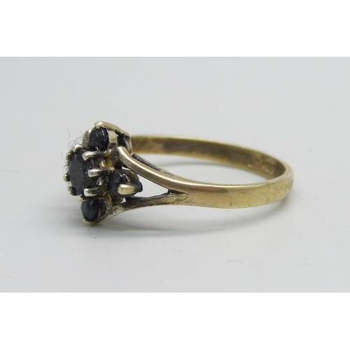 1126 - A silver gilt ring set with five sapphires, O/P