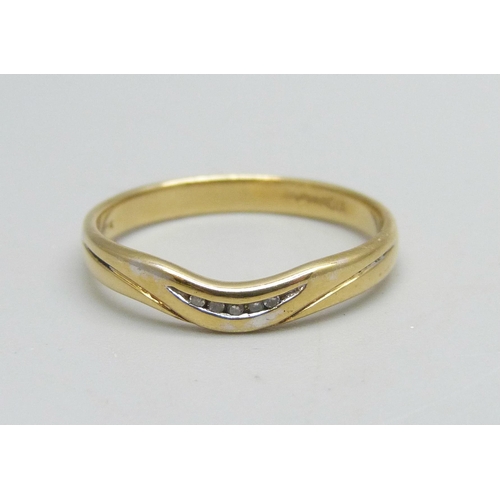 1128 - An 18ct gold ring set with five small diamonds, 2.5g, O/P