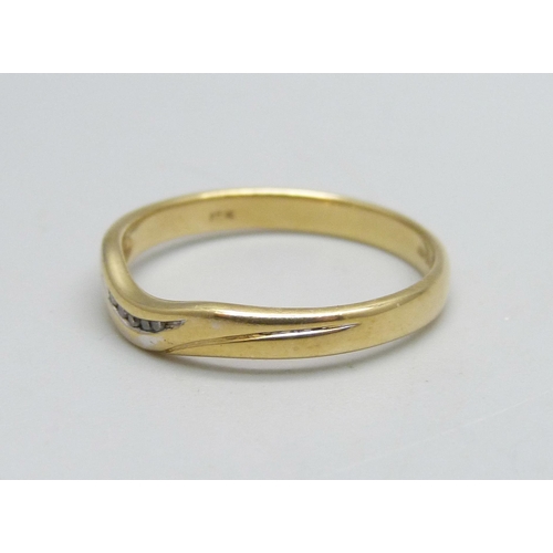 1128 - An 18ct gold ring set with five small diamonds, 2.5g, O/P