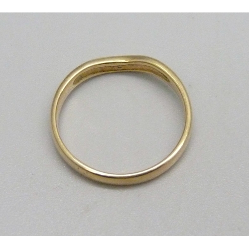 1128 - An 18ct gold ring set with five small diamonds, 2.5g, O/P