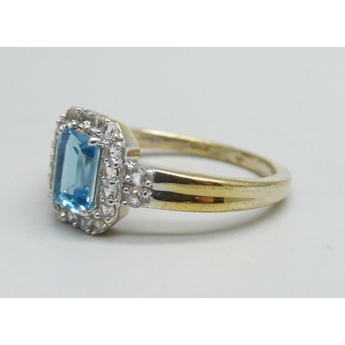 1130 - A silver gilt, Swiss blue and white topaz ring, U