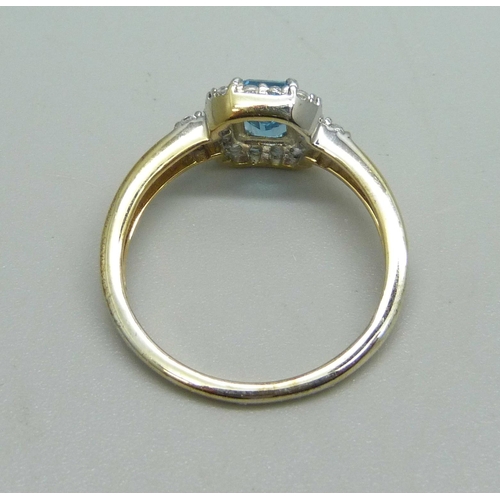 1130 - A silver gilt, Swiss blue and white topaz ring, U