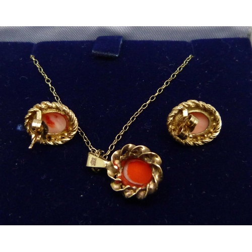 1141 - A 9ct gold and coral pendant with rope design border, with matching earrings, 1.9cm pendant drop, 6.... 