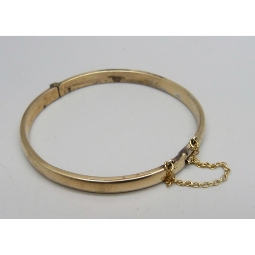 1143 - A 9ct gold bangle, 9.9g