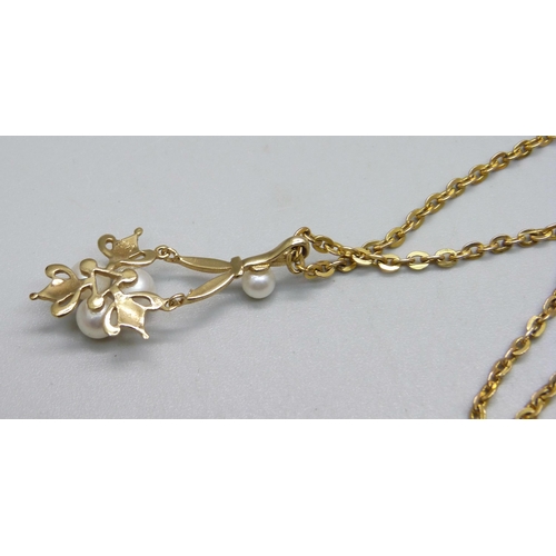 1147 - A 14k gold pearl set pendant on a yellow metal chain, replacement clasp and end links, 7g, 3.4cm pen... 