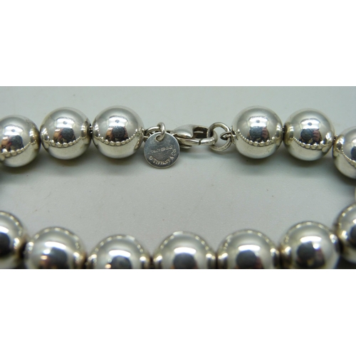 1152 - A Tiffany & Co. sterling silver ball bracelet, 17g, 17.5cm, abrasion to one bead