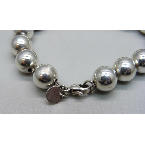 1152 - A Tiffany & Co. sterling silver ball bracelet, 17g, 17.5cm, abrasion to one bead