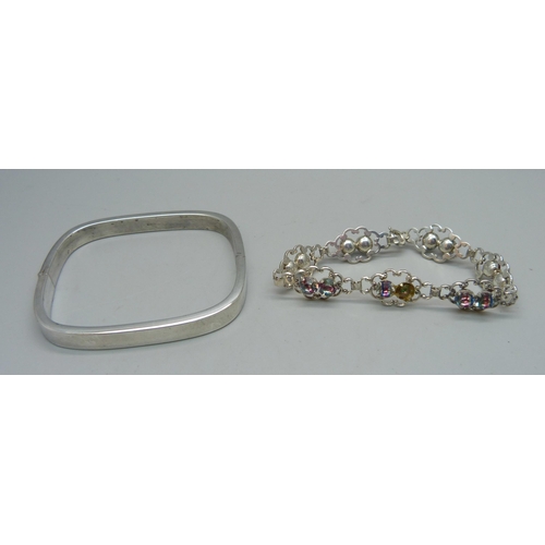 1158 - A silver bangle and a paste stone set bracelet, some stones a/f, 29g