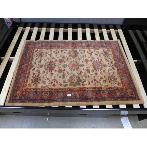 1505 - A small gold ground 100% wool pile Turkish rug