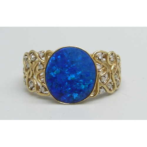 985 - A 9ct gold ring set with a boulder opal and diamonds, 3.6g, V/W