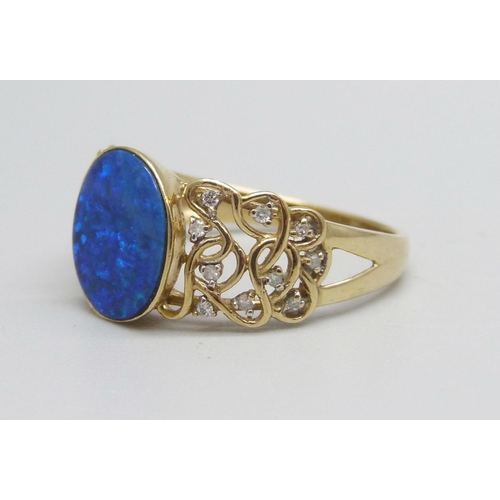 985 - A 9ct gold ring set with a boulder opal and diamonds, 3.6g, V/W