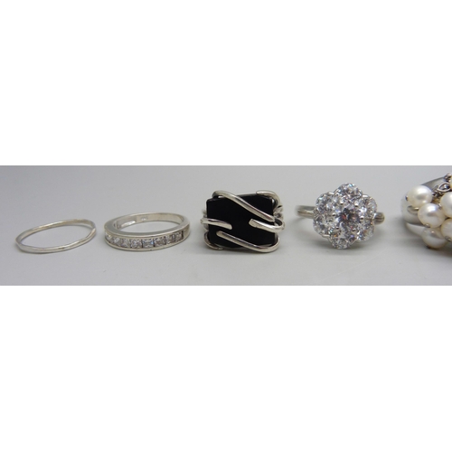 992 - Eight silver and white metal rings, six stamped as silver, black stone set ring unmarked and marcasi... 