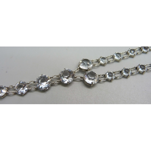 994 - An antique white metal paste set riviere necklace, extra long length, unmarked but tests as silver, ... 