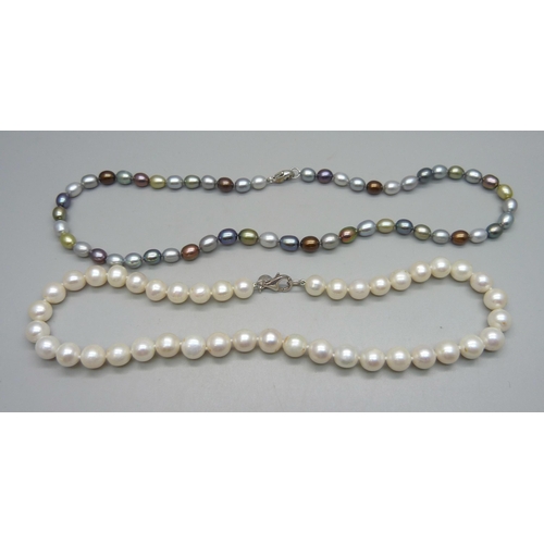 999 - Two pearl necklaces, both with silver clasps, white pearls approximately 40cm and other string 45cm