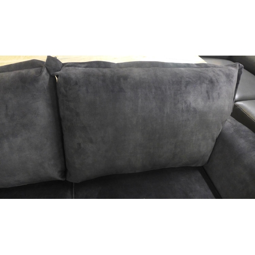 1473 - A Kingsley black shark skin effect three seater sofa on metal legs