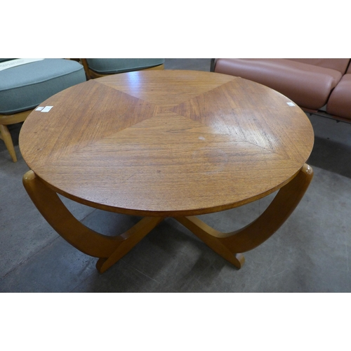 10 - A teak circular sunburst coffee table