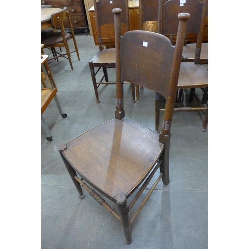 100 - A set of seven Liberty & Co. oak and elm chairs, designed by William Birch