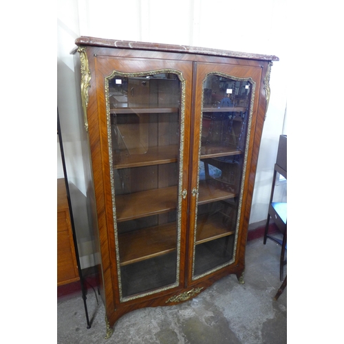 103 - A 19th Century French rosewood, gilt metal and marble topped two door vitrine