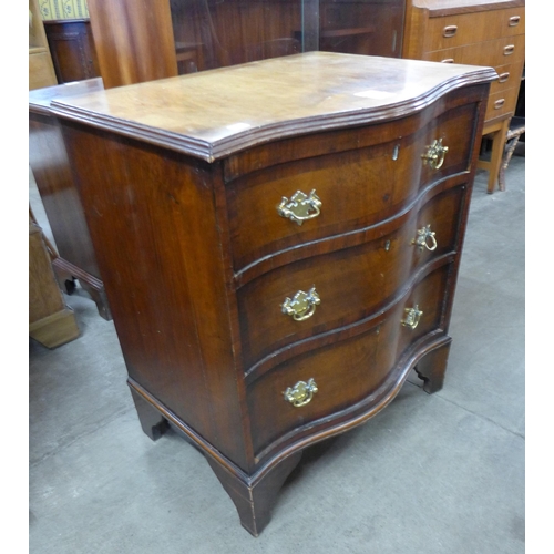 105 - A George III style mahogany serpentine bachelor's chest of drawers