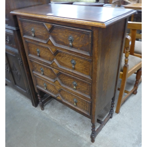 108 - An early 20th Century oak geometric moulded barleytwist chest of drawers