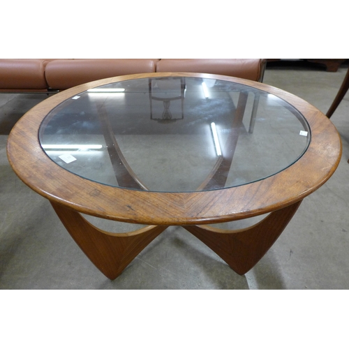 11 - A G-Plan Astro teak and glass topped circular coffee table