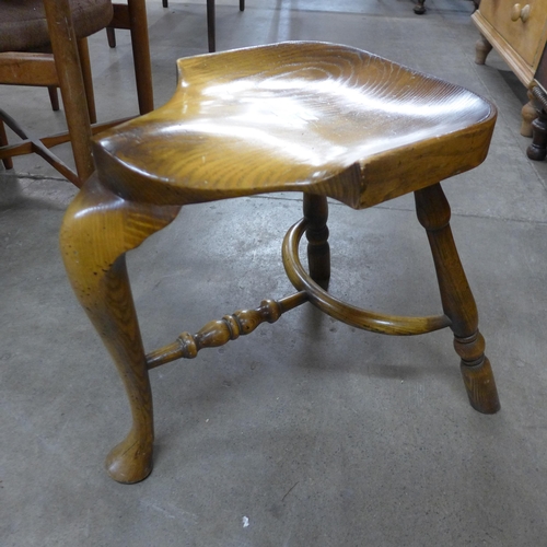 114 - An elm saddle seat stool