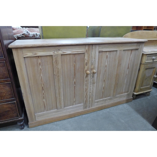 115 - A Victorian pitch pine two door pantry cupboard