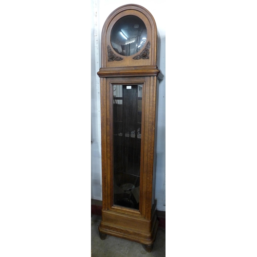 121 - An early 20th Century oak triple weight longcase clock, a/f