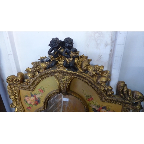 123 - An Italian Baroque style gilt framed mirror