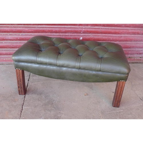 128 - A green leather Chesterfield footstool