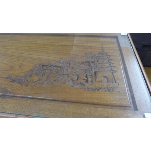 138 - A Chinese carved hardwood opium table