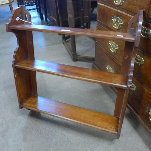 151 - A Victorian walnut wall hanging book shelf