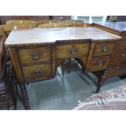 173 - A George III inverted breakfront mahogany sideboard