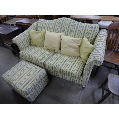 189 - A Regency style fabric upholstered drop arm settee and pouffe