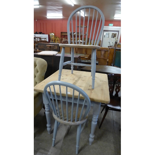 196 - A painted pine scrub top kitchen table and two chairs