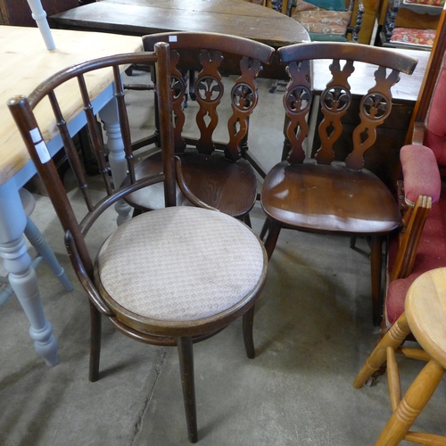 197 - A beech bentwood chair and two Ercol beech fleur de lys chairs