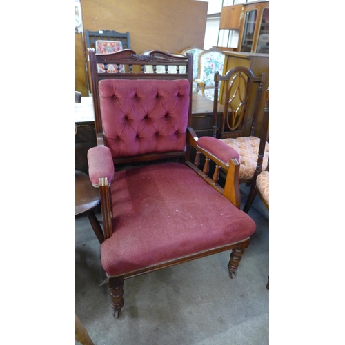 199 - A Victorian carved walnut and fabric upholstered armchair