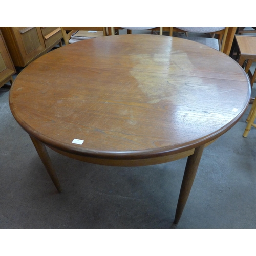 24 - A G-Plan Fresco teak circular extending dining table