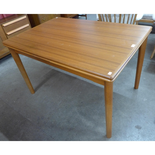 25 - A Danish teak extending dining table