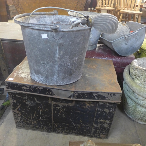 267 - Two tin deed boxes, a metal bucket, a lamp and three metal wall hanging brackets