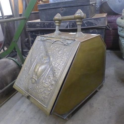 273 - A Victorian Aesthetic Movement brass coal scuttle