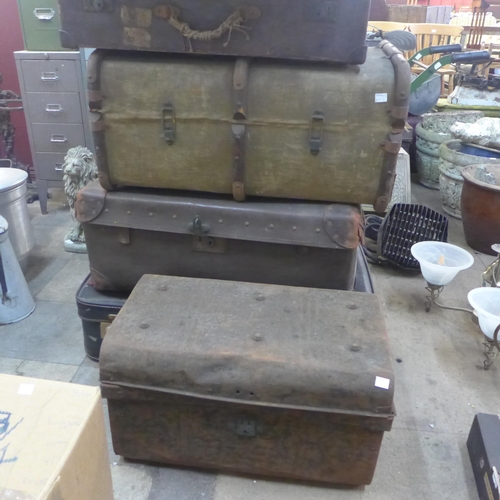 275 - Six vintage leather, metal and wooden trunks, including a 1950s suit carrier