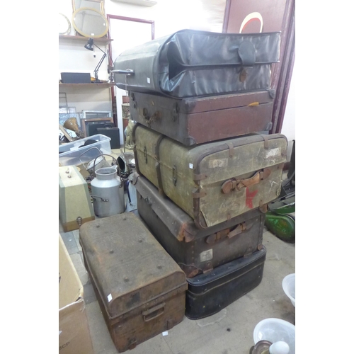 275 - Six vintage leather, metal and wooden trunks, including a 1950s suit carrier