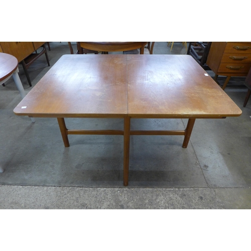 28 - A McIntosh teak extending dining table