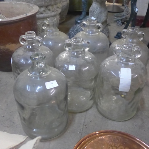 281 - A set of six glass demi-Johns and another