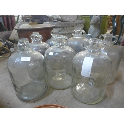 281 - A set of six glass demi-Johns and another