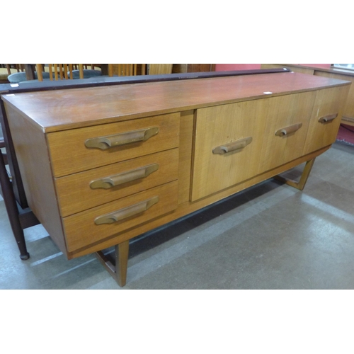 33 - A teak sideboard