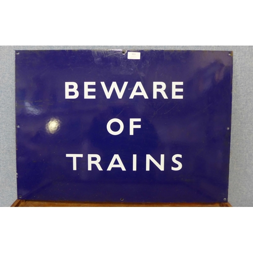 353 - A blue enamelled metal Beware of Trains sign